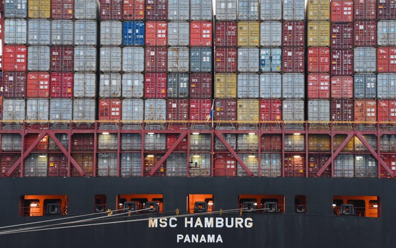 brand-01 Stacked shipping containers aboard MSC Hamburg at the bustling port of Hamburg.